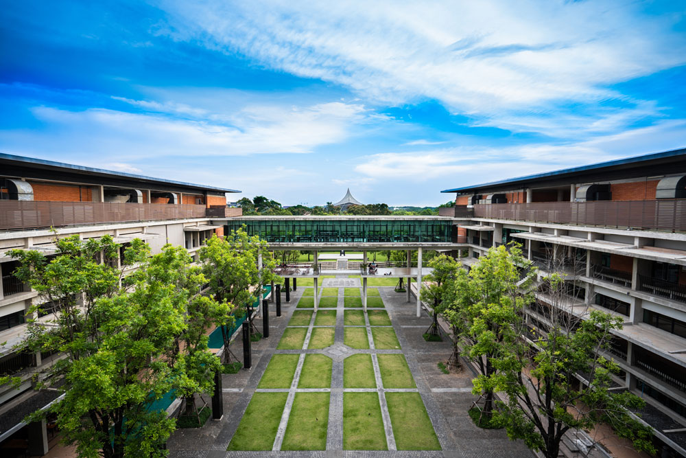 A scenic view of Mahidol University’s campus, showcasing its modern architecture and lush greenery, reflecting a blend of tradition and innovation in Thai higher education.