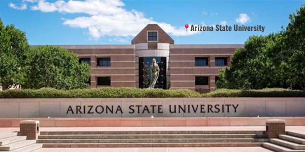 A sunny day at Arizona State University’s Tempe campus with palm trees and students walking